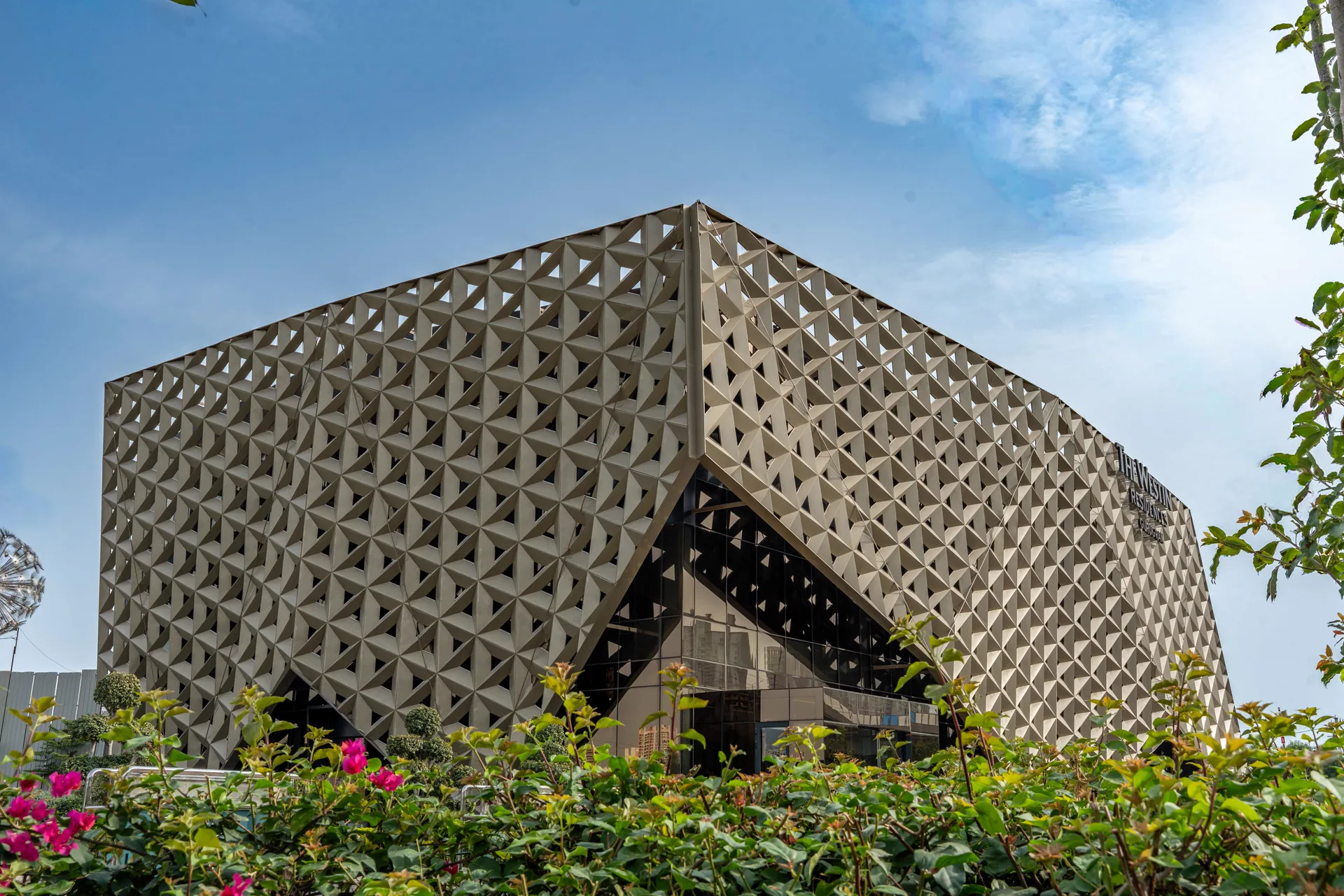 Experience centre pavilion with perforated facade