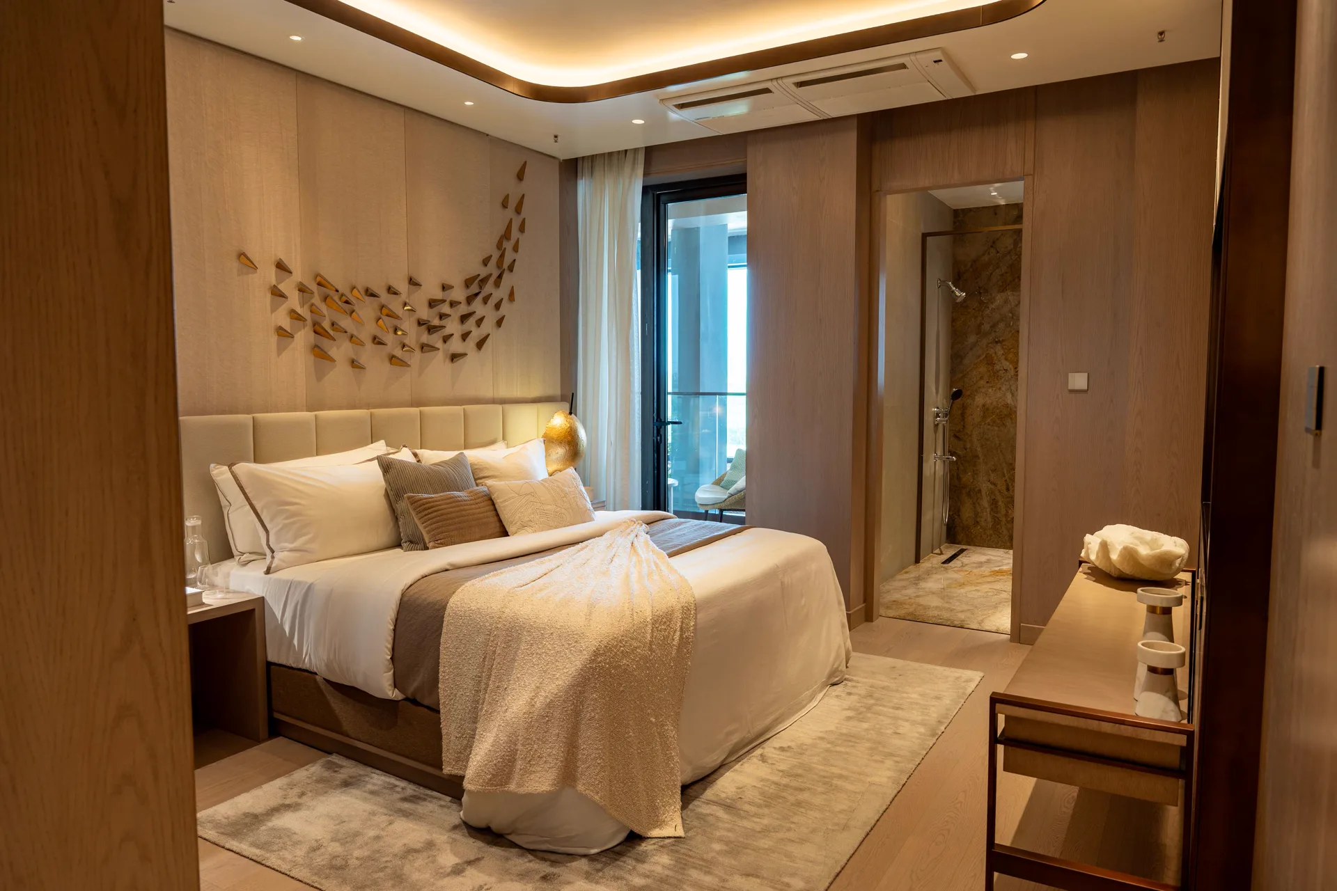 Bedroom with bird artwork above the bed